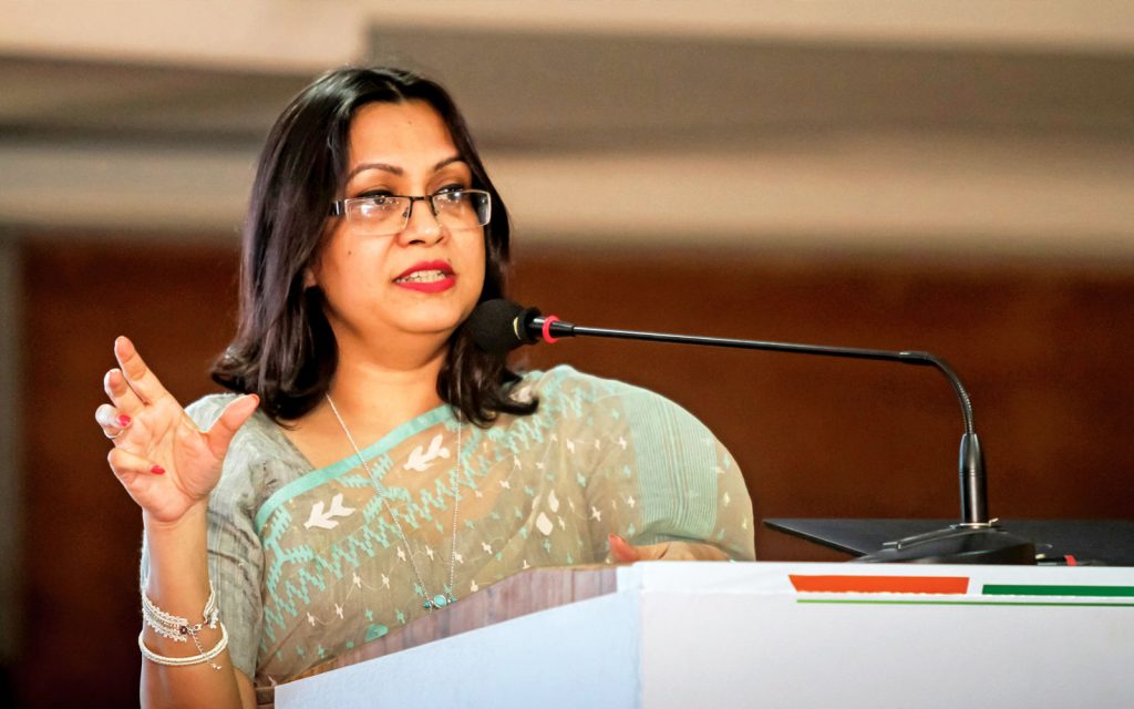 Hasin speaking at an event