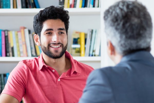 Two men sat in meeting