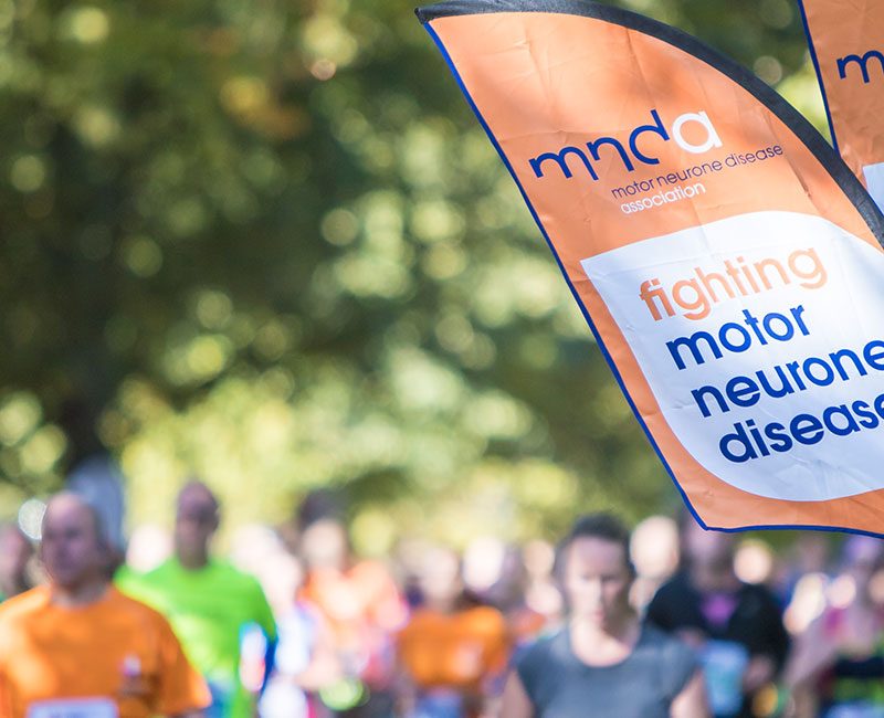 Fundraising event with MNDA flags