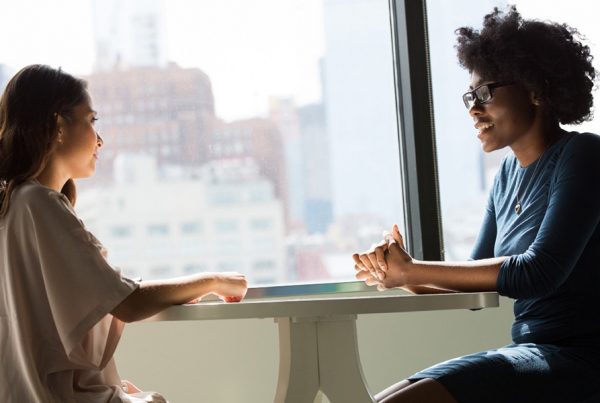 Two women sat in conversation