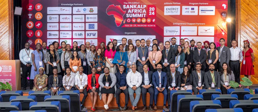Sankalp Forum members and attendees smile and pose for photo