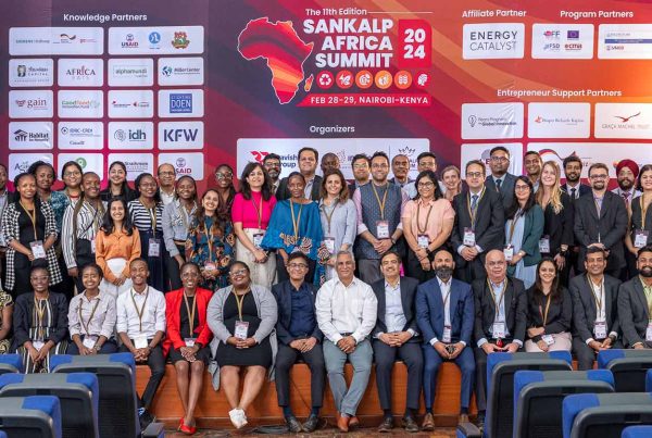 Sankalp Forum members and attendees smile and pose for photo