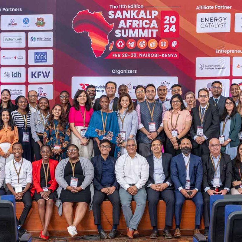 Sankalp Forum members and attendees smile and pose for photo