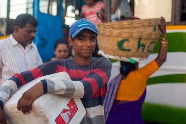Young Indian boy collecting humanitarian aid