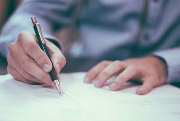 Man filling out assessment form
