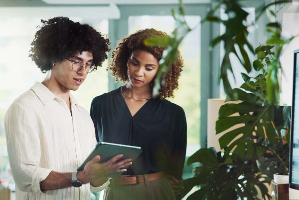 Two younger colleagues in discussion