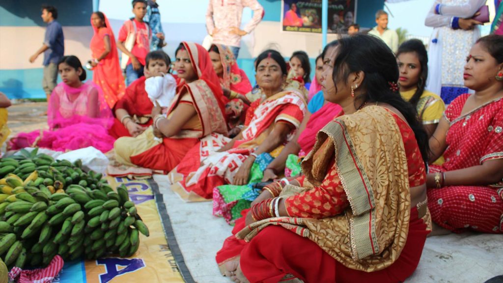 a group of women sitting next to each other