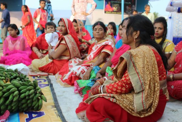 a group of women sitting next to each other