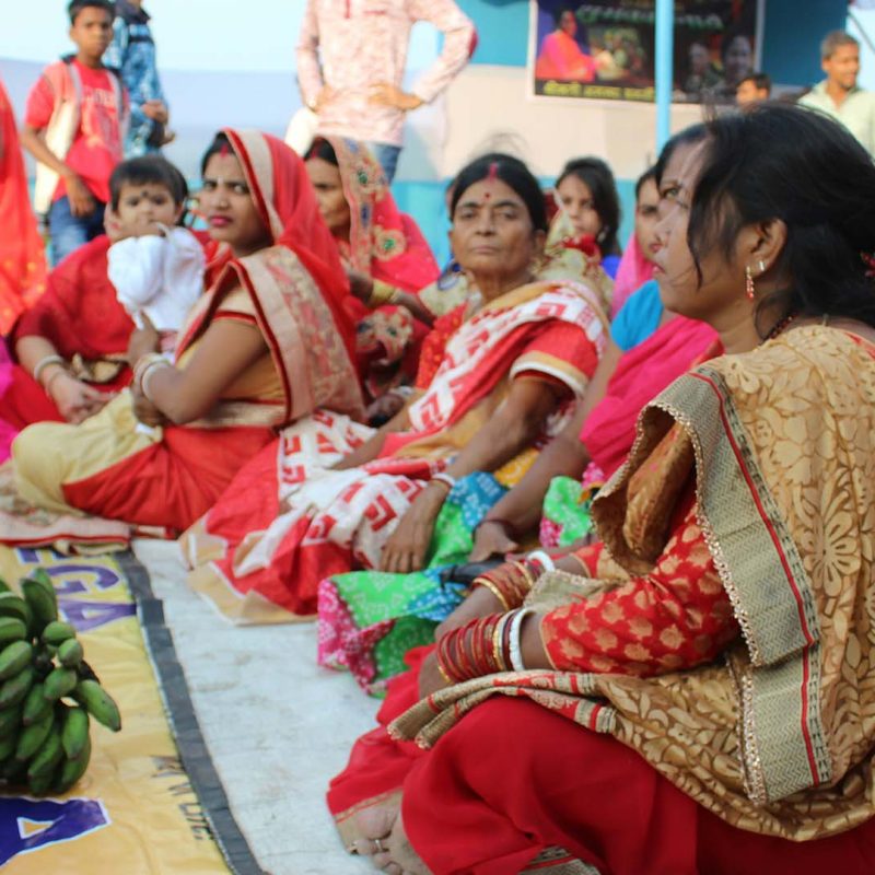 a group of women sitting next to each other