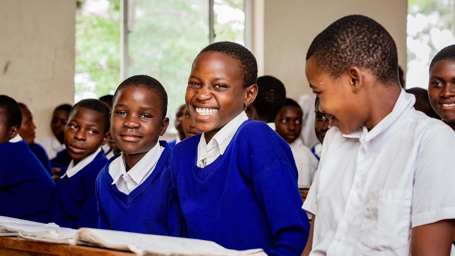 Happy students in class at school in Geita region. Copyright Zoey's_Studios