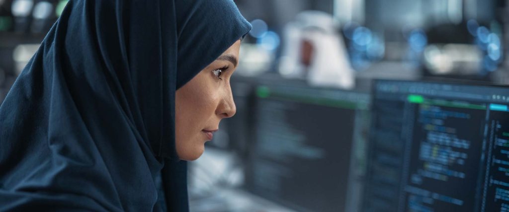 Woman examining information on a monitor