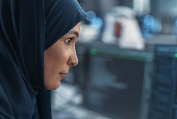 Woman examining information on a monitor