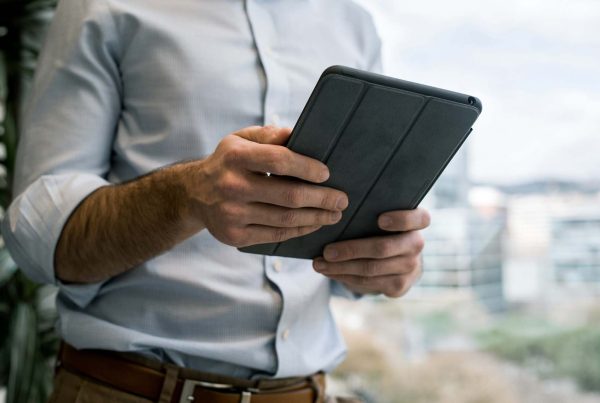 Man holding iPad in office