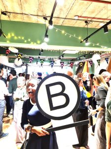 Janet holding B Corp sign