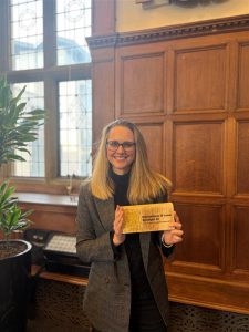 Zoe holding B Corp plaque